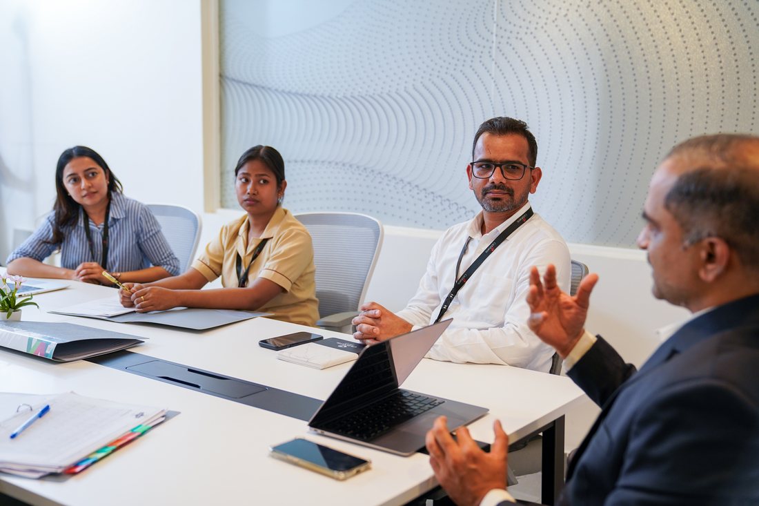 A corporate boardroom discussion, photographed for a client