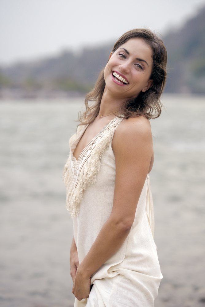 A smiling editorial portrait by the river, photographed by Capturekraft