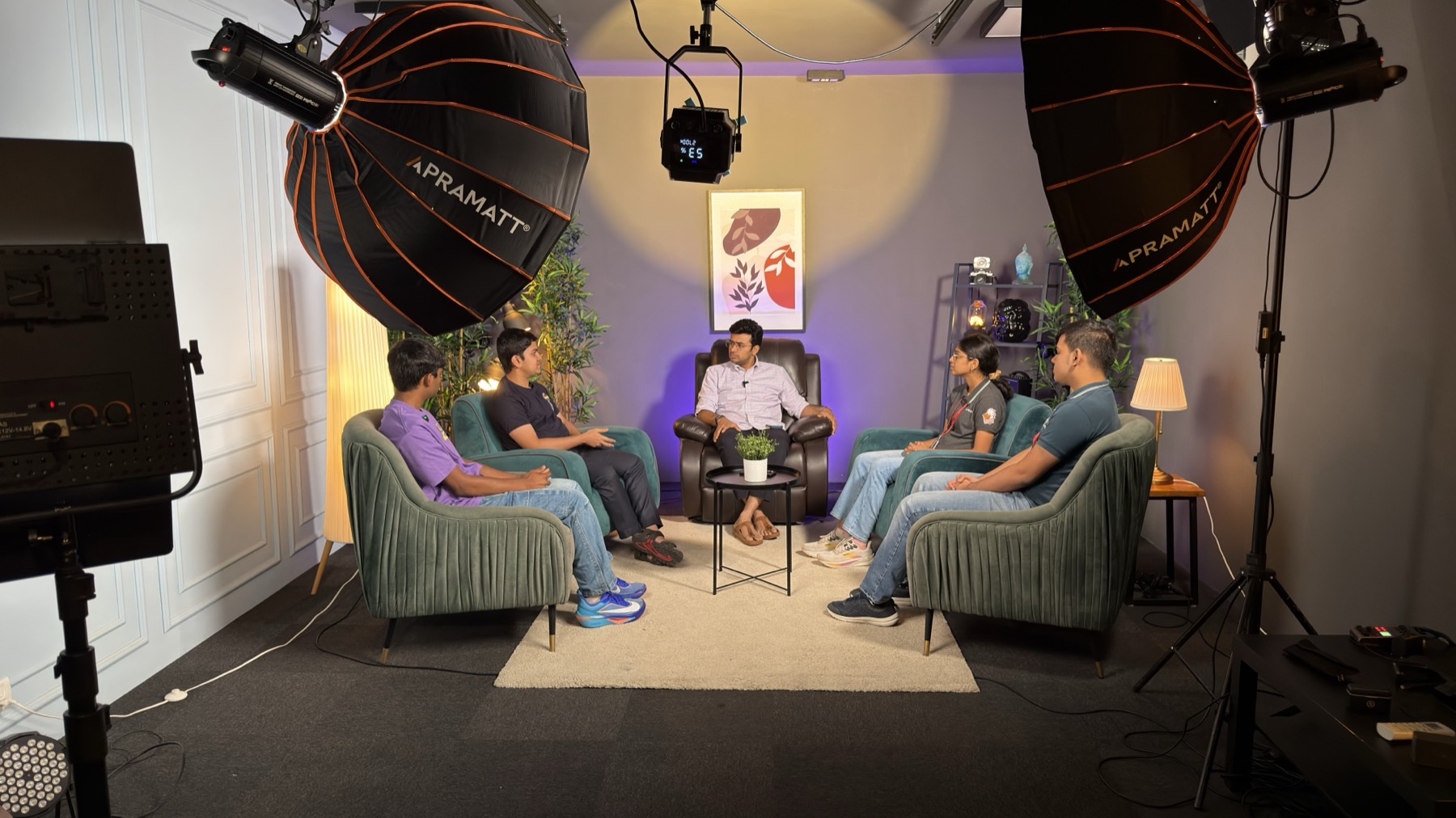 A five-person panel recording on the Roundtable set
